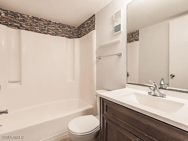 full bathroom with bathtub / shower combination, vanity, and toilet