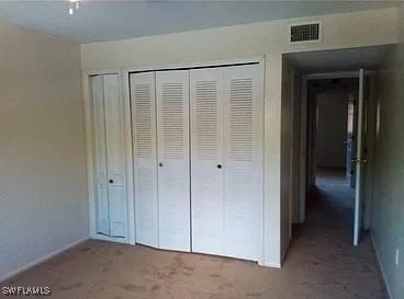 unfurnished bedroom featuring carpet flooring