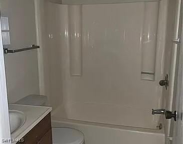 full bathroom with shower / bathing tub combination, vanity, and toilet