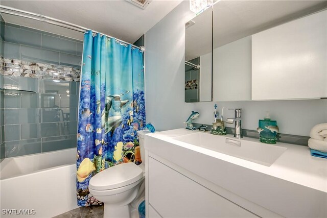 full bathroom with vanity, toilet, and shower / tub combo with curtain