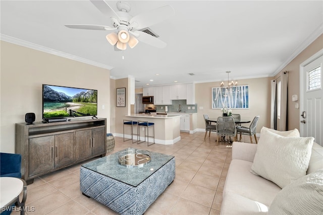 living room featuring crown molding, light tile patterned flooring, and ceiling fan with notable chandelier