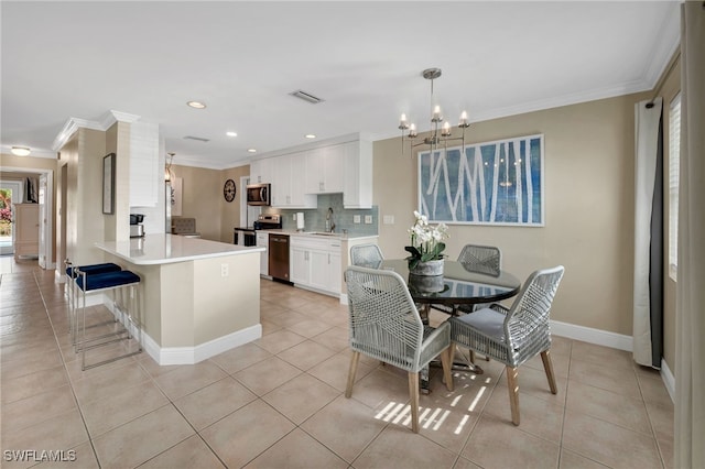 kitchen featuring white cabinets, light tile patterned floors, sink, and appliances with stainless steel finishes