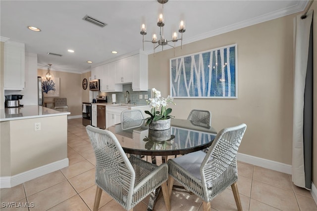 dining area featuring sink, light tile patterned flooring, ornamental molding, and a notable chandelier