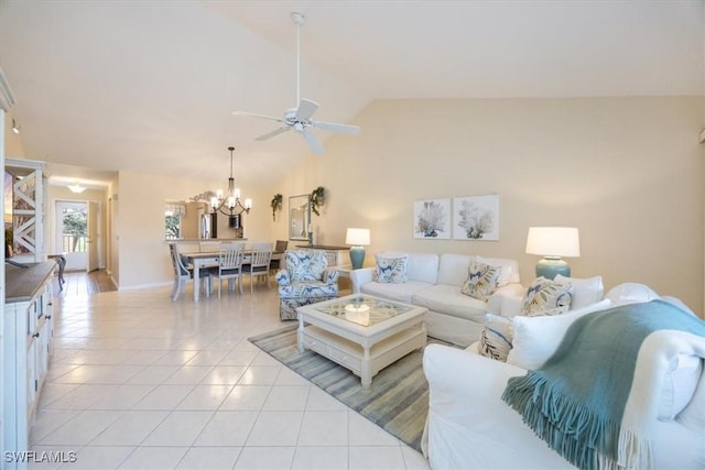 living room featuring lofted ceiling, ceiling fan with notable chandelier, and light tile patterned floors