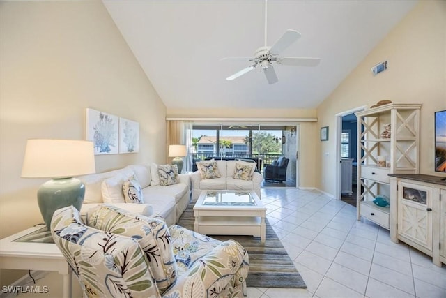 living room featuring high vaulted ceiling, light tile patterned flooring, visible vents, a ceiling fan, and baseboards