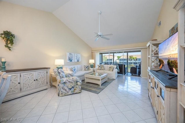 living room featuring high vaulted ceiling, a ceiling fan, visible vents, and light tile patterned floors