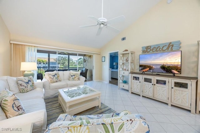 living room with high vaulted ceiling, light tile patterned flooring, and a ceiling fan