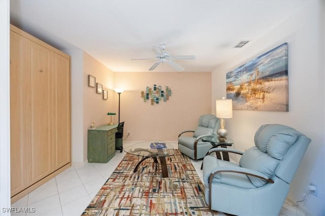 sitting room with light tile patterned floors, ceiling fan, and visible vents