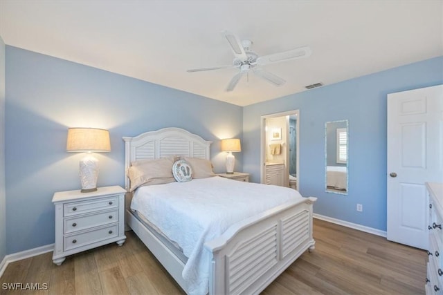 bedroom featuring a ceiling fan, wood finished floors, connected bathroom, and baseboards