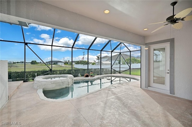 view of pool featuring an in ground hot tub and ceiling fan