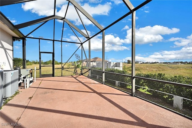 view of patio featuring a lanai and central AC unit