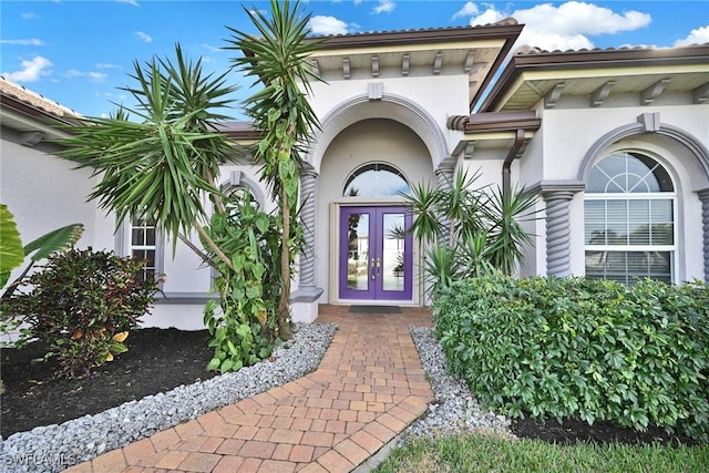 doorway to property featuring french doors