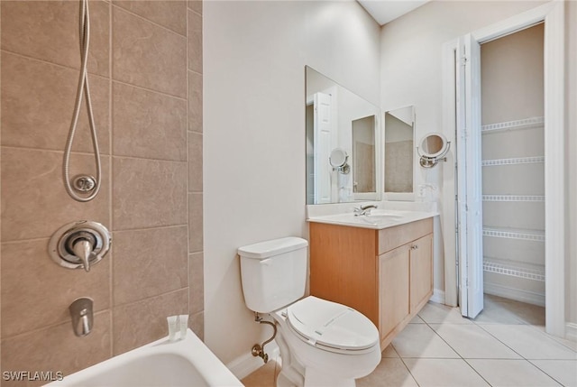 full bathroom featuring toilet, tiled shower / bath, vanity, and tile patterned floors