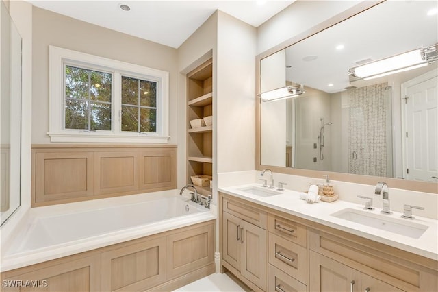 bathroom featuring vanity, built in features, and plus walk in shower