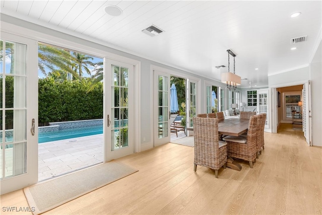 sunroom / solarium with a pool, wooden ceiling, and french doors