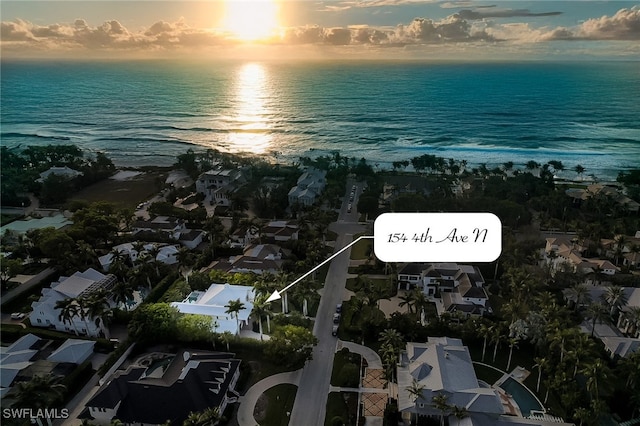 aerial view at dusk with a water view