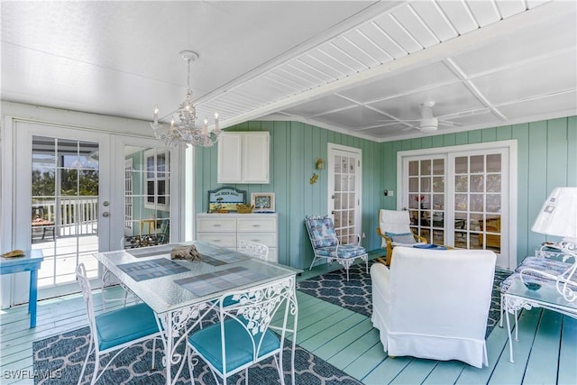 interior space with french doors and ceiling fan