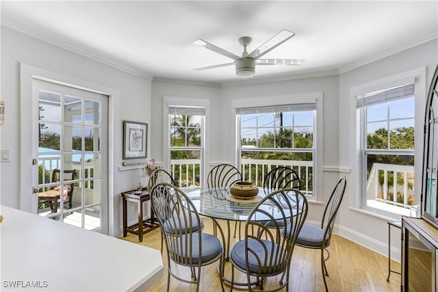 dining area with light hardwood / wood-style flooring, ceiling fan, and ornamental molding