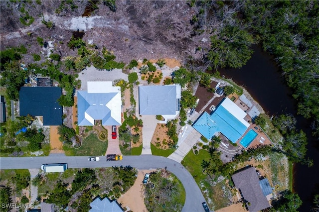 birds eye view of property featuring a water view