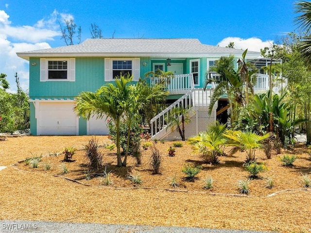 view of front of property featuring covered porch and a garage