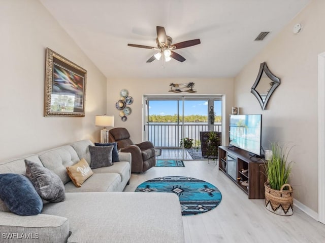 living room featuring hardwood / wood-style flooring and ceiling fan