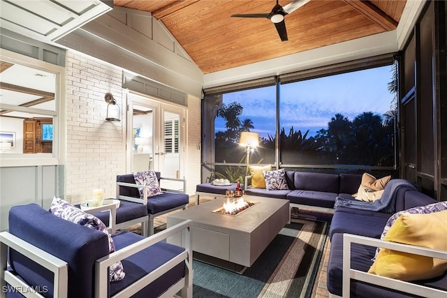 sunroom / solarium with ceiling fan, wooden ceiling, and lofted ceiling