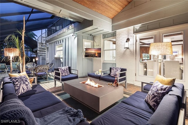 interior space featuring lofted ceiling, wooden ceiling, and brick wall