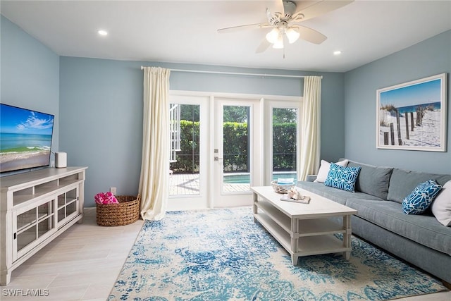 living room featuring a ceiling fan, recessed lighting, and wood finished floors