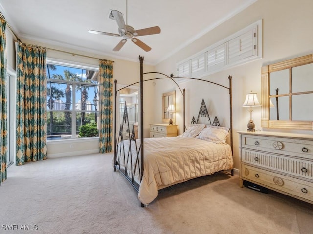 bedroom featuring ceiling fan, light colored carpet, and crown molding