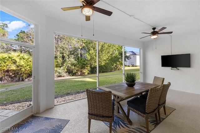 sunroom / solarium with ceiling fan