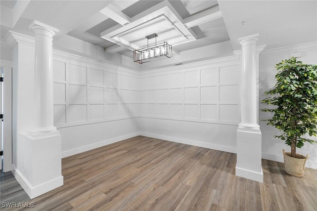 unfurnished room featuring hardwood / wood-style floors and crown molding