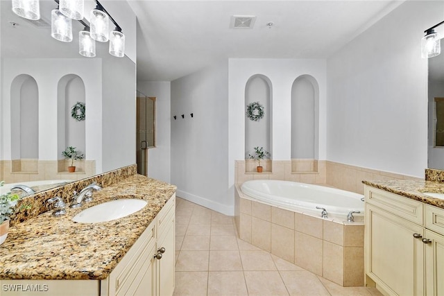 bathroom featuring tile patterned flooring, vanity, and independent shower and bath