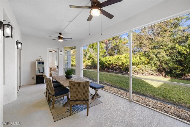 sunroom / solarium featuring ceiling fan and a healthy amount of sunlight