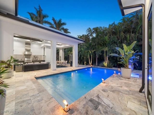 pool with an outdoor hangout area, a patio, area for grilling, and a ceiling fan