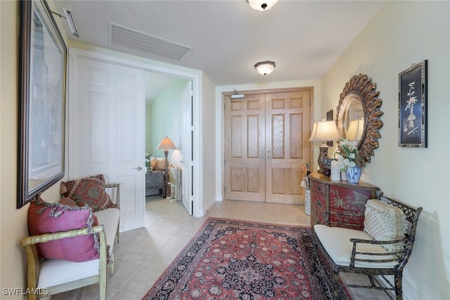 foyer entrance featuring light tile patterned flooring