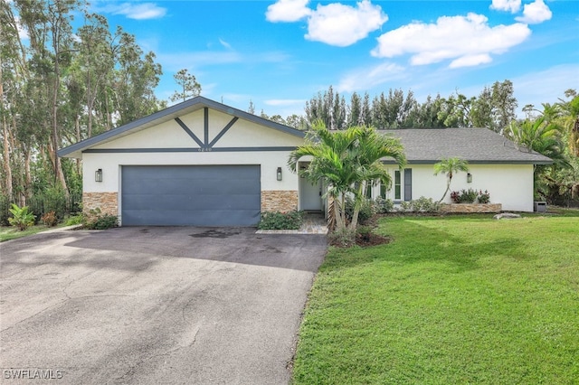 single story home with a front yard and a garage