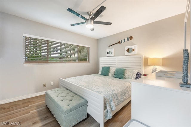 bedroom featuring hardwood / wood-style flooring and ceiling fan