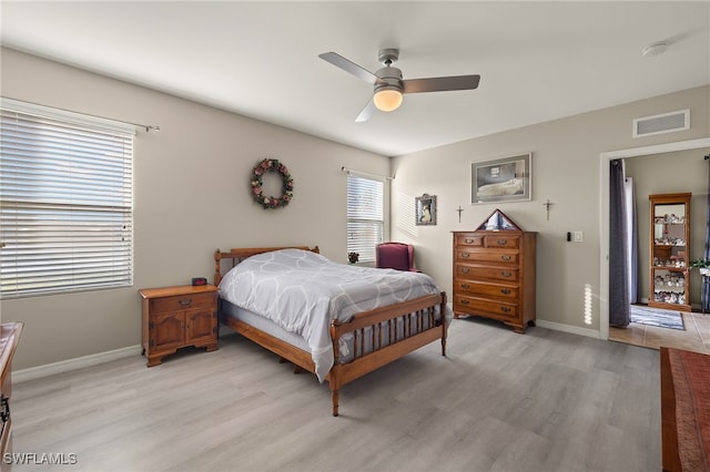 bedroom featuring light hardwood / wood-style flooring and ceiling fan