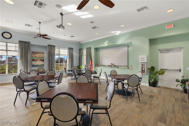 dining space featuring light hardwood / wood-style flooring, ceiling fan, and ornamental molding