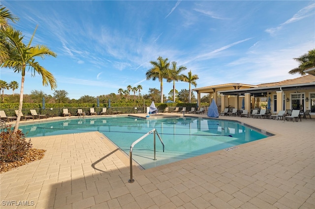 view of swimming pool with a patio