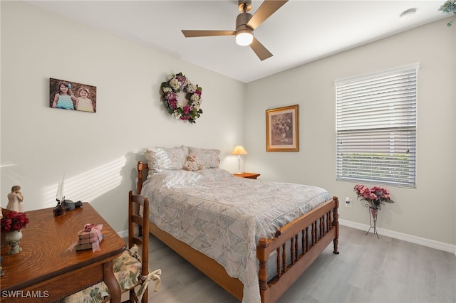 bedroom featuring ceiling fan and light hardwood / wood-style floors