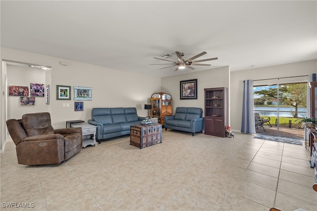 living room featuring ceiling fan and light tile patterned floors