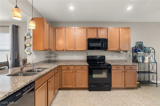 kitchen featuring light stone countertops, sink, black appliances, decorative light fixtures, and light tile patterned flooring