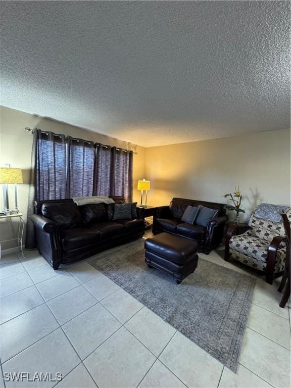 living room with light tile patterned floors and a textured ceiling