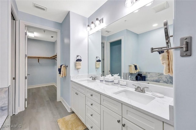 bathroom featuring vanity and hardwood / wood-style flooring