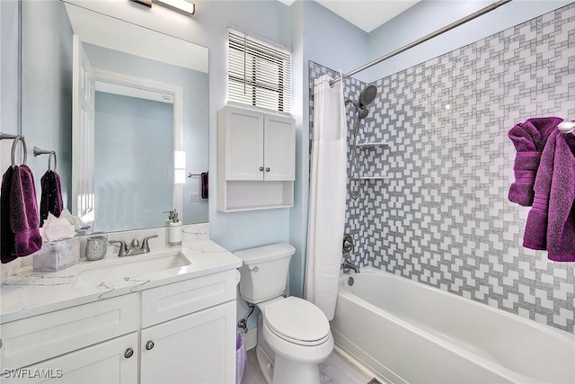 full bathroom with vanity, toilet, and shower / bath combo with shower curtain