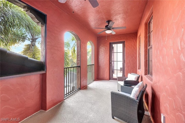 sunroom / solarium with ceiling fan