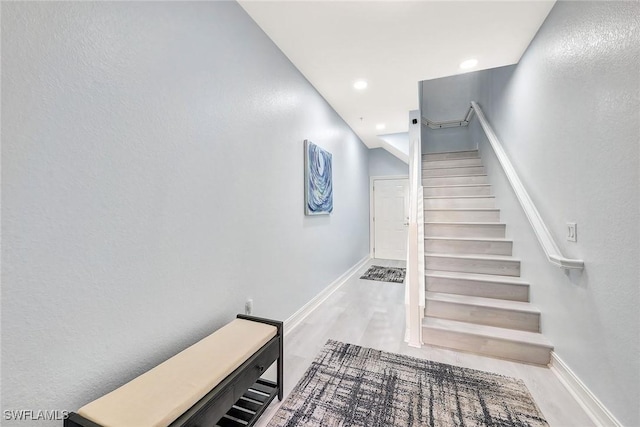 staircase featuring hardwood / wood-style floors