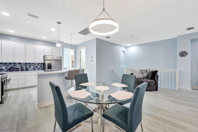 dining area featuring light hardwood / wood-style floors