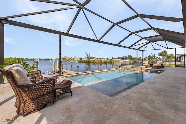 view of swimming pool with glass enclosure, a water view, an in ground hot tub, and a patio